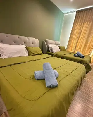 a bedroom with two beds with towels on them at Setapak Central Mall 2 Bed Zetapark Home Sweet Home in Kuala Lumpur