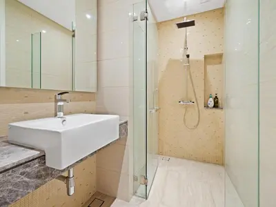 a bathroom with a sink and a shower at Leo Guesthouse at Anggun Residence Suite in Kuala Lumpur