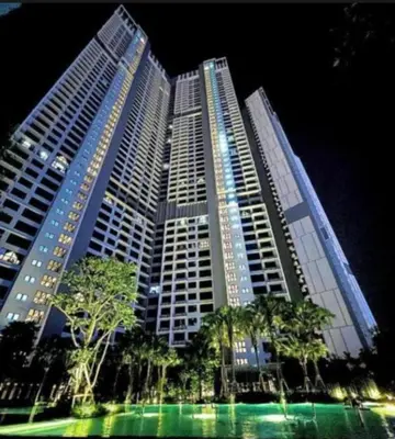 a large tall building with trees in front of it at KHR Service Suites Agile Bukit Bintang in Kuala Lumpur