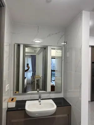 a bathroom with a sink and a mirror at KHR Service Suites Agile Bukit Bintang in Kuala Lumpur