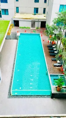 an overhead view of a swimming pool in a building at The Mercu Summer Suites By Skyline in Kuala Lumpur