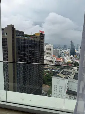a view of a city skyline from a window at Quill Residence - Sky Glass Condo by Azmila in Kuala Lumpur