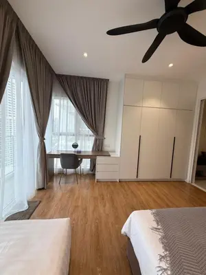 a bedroom with two beds and a ceiling fan at Quill Residence - Sky Glass Condo by Azmila in Kuala Lumpur