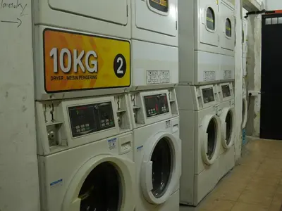 a group of washing machines in a laundromat at Mingle Lekiu in Kuala Lumpur