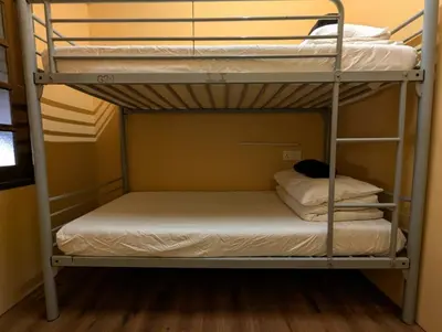 a bunk bed in a room with two bunk beds at Mingle Lekiu in Kuala Lumpur