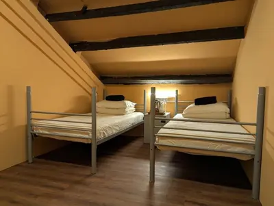 two bunk beds in a room with a ceiling at Mingle Lekiu in Kuala Lumpur