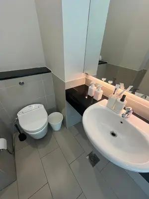 a bathroom with a sink and a toilet at Stay Haven at Swiss Garden in Kuala Lumpur