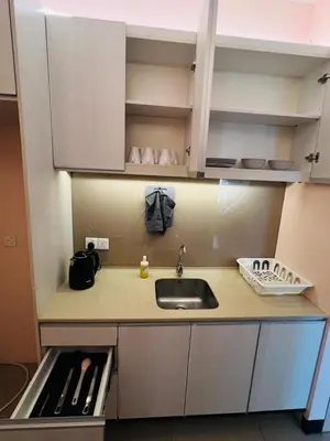 a kitchen with a sink and a counter top at Stay Haven at Swiss Garden in Kuala Lumpur