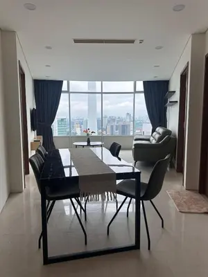 a dining room with a table and chairs in a room at Newly Renovated 3 Bedroom Vortex Suites KLCC by Tharwa in Kuala Lumpur