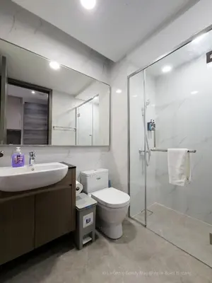 a bathroom with a sink and a toilet and a shower at La Gente x Agile Bukit Bintang TRX Pavilion KL in Kuala Lumpur
