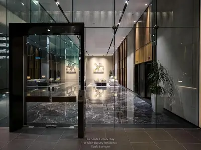 a lobby with a glass door in a building at Luxe Spacious 2BR Condo KLCC 600mbps Full Furnish in Kuala Lumpur