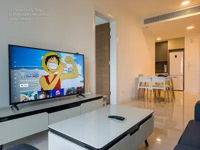 a living room with a large flat screen tv at 2R2B KLCC ARIA Hi Luxury Amazing Facilities ZEN in Kuala Lumpur