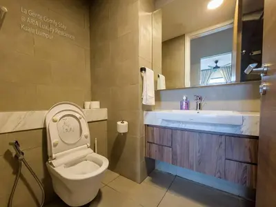 a bathroom with a toilet and a sink at 2R2B KLCC ARIA Hi Luxury Amazing Facilities ZEN in Kuala Lumpur