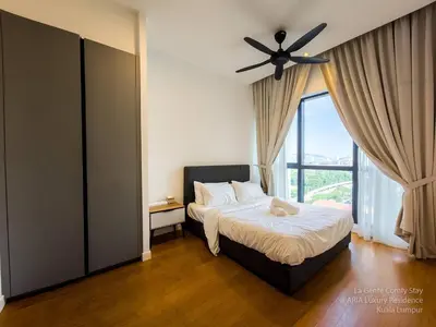 a bedroom with a bed with a ceiling fan at 2R2B KLCC ARIA Hi Luxury Amazing Facilities ZEN in Kuala Lumpur