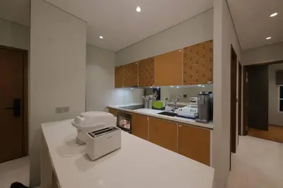 a kitchen with a counter with a appliance on it at 3R2B SkySuites Next to KLCC Twin Tower High Floor in Kuala Lumpur