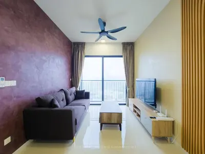a living room with a couch and a ceiling fan at 3BR Sunway Velocity 2 TRX KLCC in Kuala Lumpur