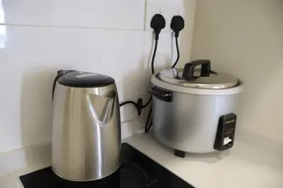 a coffee maker sitting on top of a kitchen counter at COZY KenwingstonThe platz Trail 3BR&2BR For 8PAX wifi free Parkin nice view 1902 in Kuala Lumpur