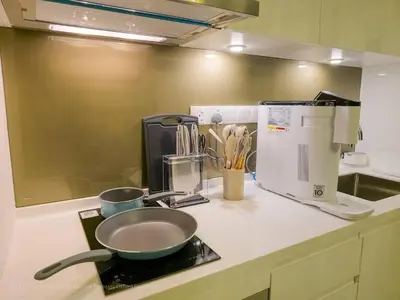 a kitchen counter with a frying pan and a mixer at 4R3B Luxe KLCC Embassy Pavilion 600MBPS Gas cook in Kuala Lumpur