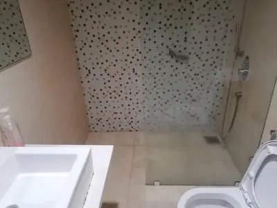 a bathroom with a sink and a shower and a toilet at REGALIA RESIDENCE KLCC VIEW INFINITY POOL by BT RZQNA in Kuala Lumpur