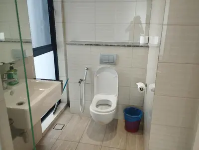 a small bathroom with a toilet and a sink at Anggun Residence by Harmony Home in Kuala Lumpur