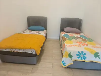 two beds sitting next to each other in a room at M city jalan ampang 5mins to klcc water filter walk to shoplot in Kuala Lumpur