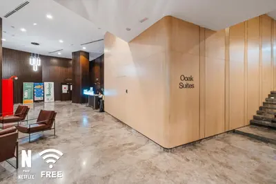 a lobby with a wall with a sign that reads oak skies at OOAK 2BR - Mont Kiara Garden international school in Kuala Lumpur