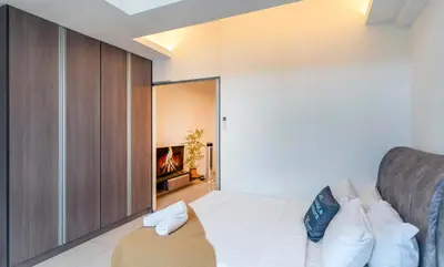 a bedroom with a bed and a fireplace at Carlton, Chelsea by COBNB, Sri Hartamas, Kuala Lumpur in Kuala Lumpur