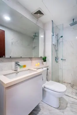 a bathroom with a toilet and a sink and a shower at Carlton, Chelsea by COBNB, Sri Hartamas, Kuala Lumpur in Kuala Lumpur