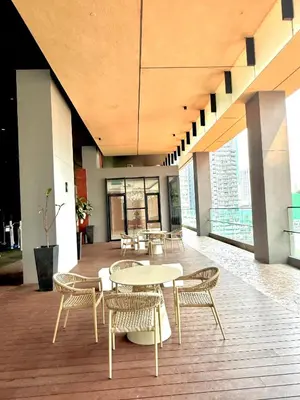 a room with tables and chairs in a building at LUXURY AXON SUITES KLCC PAVILION At BUKIT BINTANG in Kuala Lumpur