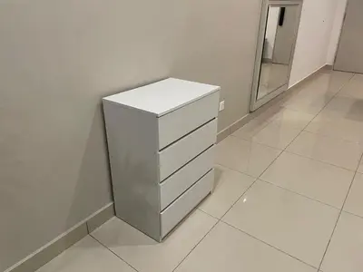 a white dresser in a room with a mirror at Weekend House Trion in Kuala Lumpur
