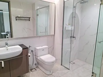 a bathroom with a toilet and a glass shower at Agile Residensi Service Apartment Kuala lumpur in Kuala Lumpur