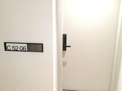 an open door with a clock on it at Agile Residensi Service Apartment Kuala lumpur in Kuala Lumpur