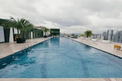 a large swimming pool on top of a building at Dorsett Hartamas KL, Bathtub Smart TV & WiFi in Kuala Lumpur