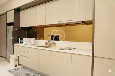 a kitchen with white cabinets and a sink at Dorsett Hartamas KL, Bathtub Smart TV & WiFi in Kuala Lumpur