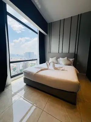 a bedroom with a large bed with a large window at Axon Suites Bukit Bintang near KLCC by Unitopia in Kuala Lumpur