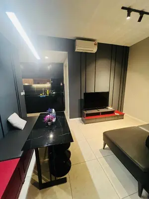 a living room with a black table and a couch at Axon Suites Bukit Bintang near KLCC by Unitopia in Kuala Lumpur