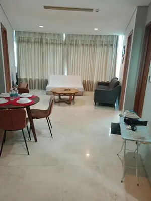 a living room with a couch and a table at Vortex suites klcc by yana in Kuala Lumpur