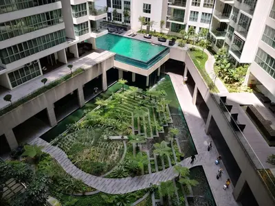 an overhead view of a courtyard in a building with a pool at Regalia Suites Kuala Lumpur by Cozyvista Suites in Kuala Lumpur