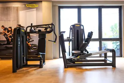 a gym with two tread machines in a room at M Vertica KL City Residences by Vivid Stay in Kuala Lumpur