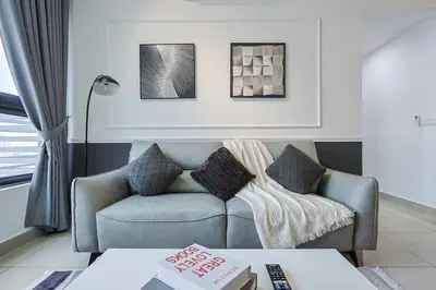 a living room with a couch and a table at M Vertica KL City Residences by Vivid Stay in Kuala Lumpur