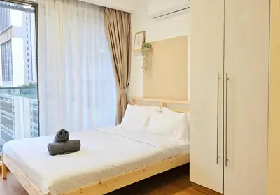a bedroom with a bed and a large window at Bintang Fairlane Bukit Bintang #121 near Pavilion KLCC Kuala Lumpur in Kuala Lumpur