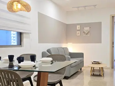 a living room with a table and chairs and a couch at Bintang Fairlane Bukit Bintang #121 near Pavilion KLCC Kuala Lumpur in Kuala Lumpur