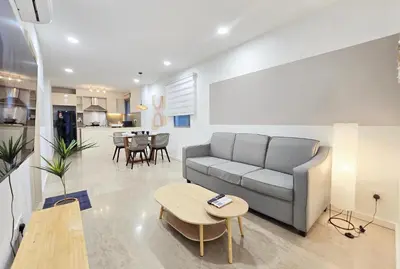 a living room with a couch and a table at Bintang Fairlane Bukit Bintang #121 near Pavilion KLCC Kuala Lumpur in Kuala Lumpur