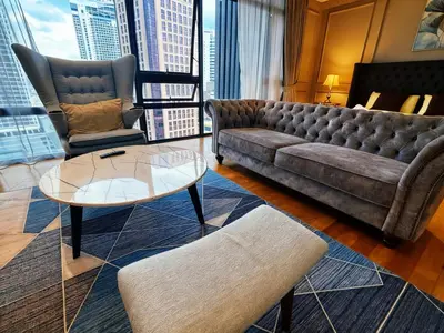 a living room with a couch and a table at KLCC Bukit Bintang Anggun Residence 5min walk to Monorail station in Kuala Lumpur