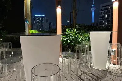 a group of wine glasses sitting on top of a table at Majestic Residence KLCC By Flixhome in Kuala Lumpur