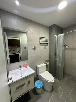 a bathroom with a toilet and a sink and a shower at Majestic Residence KLCC By Flixhome in Kuala Lumpur