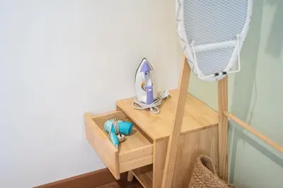 a small wooden table with a mirror on top of it at up tp 9pax with Slide, Rock Climbing, Arcade, near City & MITEC in Kuala Lumpur