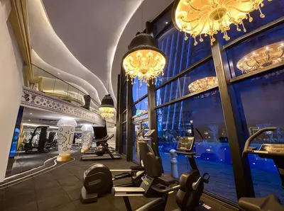a gym in a hotel with a large window at up tp 9pax with Slide, Rock Climbing, Arcade, near City & MITEC in Kuala Lumpur