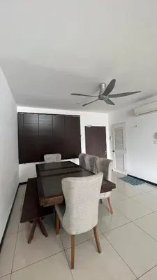 a dining room with a table and a ceiling fan at AF Guesthouse Kampung Baru, KL in Kuala Lumpur