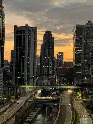 a view of a city with a highway and buildings at AF Guesthouse Kampung Baru, KL in Kuala Lumpur